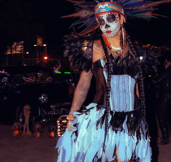 Colorful costume with feathers and beads.